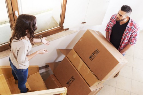 Professional apartment moving service in Finsbury loading boxes into a van