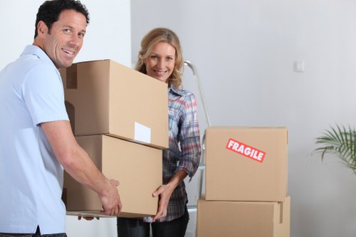 Packed boxes and moving team preparing a Finsbury home relocation